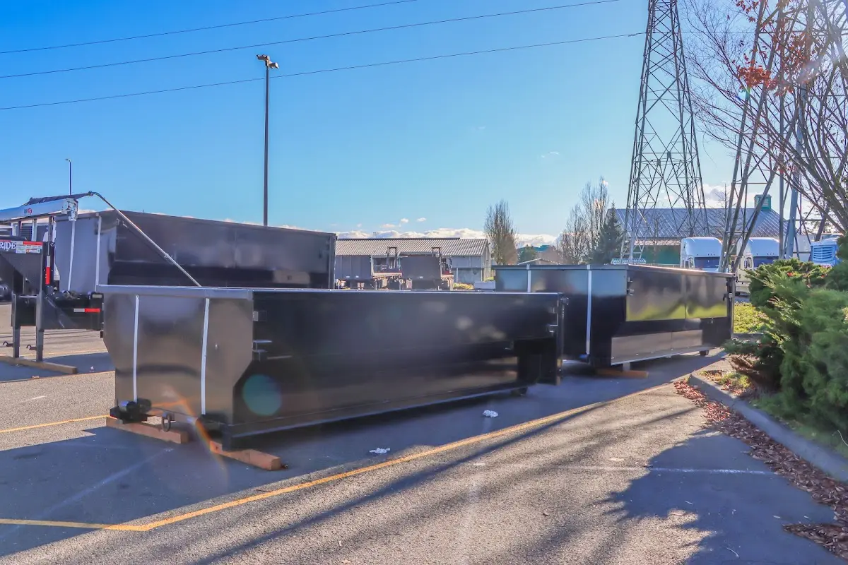Roll-off dumpster ready for waste disposal at job site for 2 Yard Dumpster Rental in Lathrop